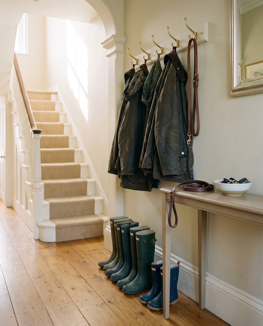 A hallway in one of the houses, light falling across the floor